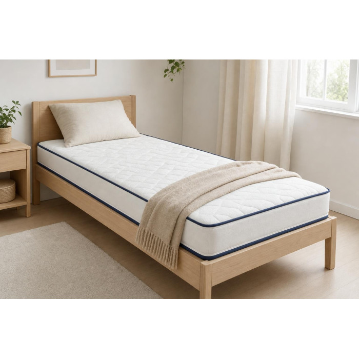 Matelas 90x190 15 cm Calinuit posé sur un lit une place dans une chambre lumineuse