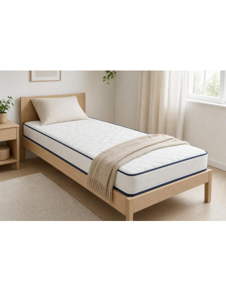 Matelas 90x190 15 cm Calinuit posé sur un lit une place dans une chambre lumineuse